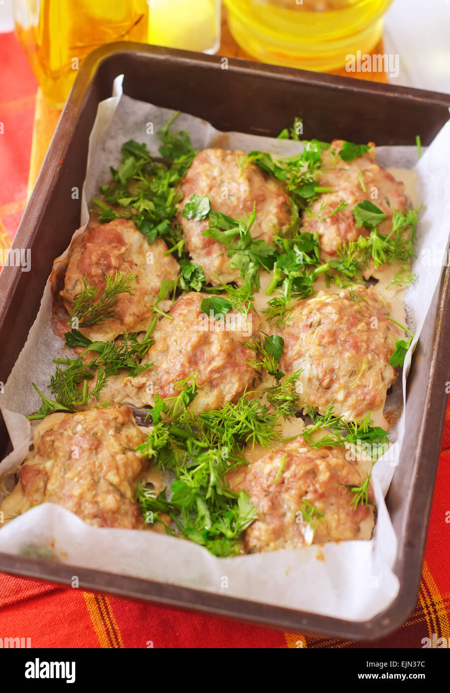 Baked meat balls with the greens Stock Photo