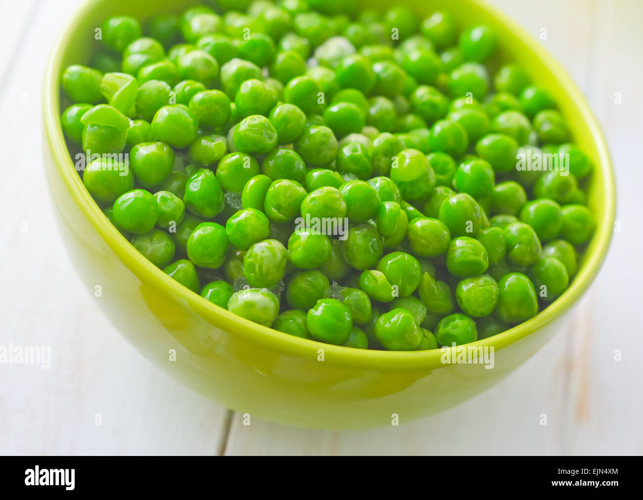 fresh green peas in the green bowl Stock Photo