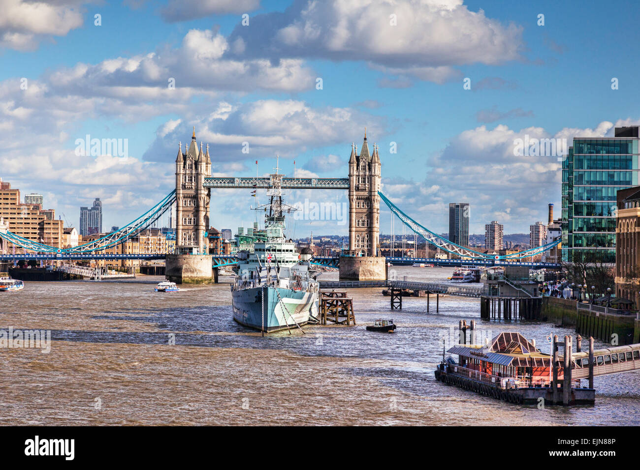 HMS Belfast on the River Thames, and Tower Bridge, London. Stock Photo