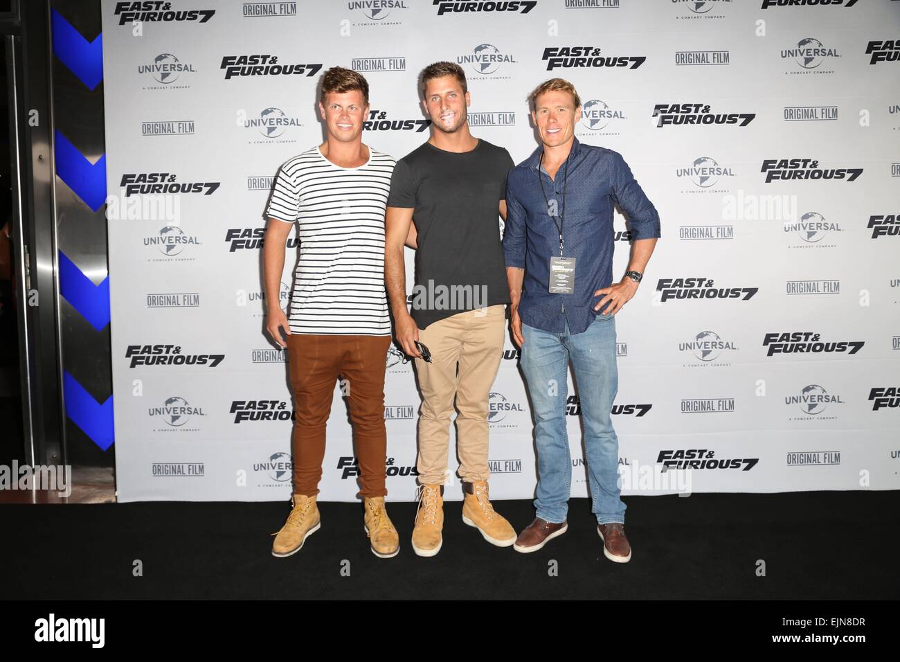 Sydney, Australia. 30 March 2015. Celebrities arrived on the red carpet for the Sydney Premiere of Fast and Furious 7, in conjunction with Triple M radio, held at Hoyts Entertainment Quarter. Pictured are Bondi Rescue Lifeguards, L-R: Harrison Reid, tbc and tbc. Credit:  Richard Milnes/Alamy Live News Stock Photo