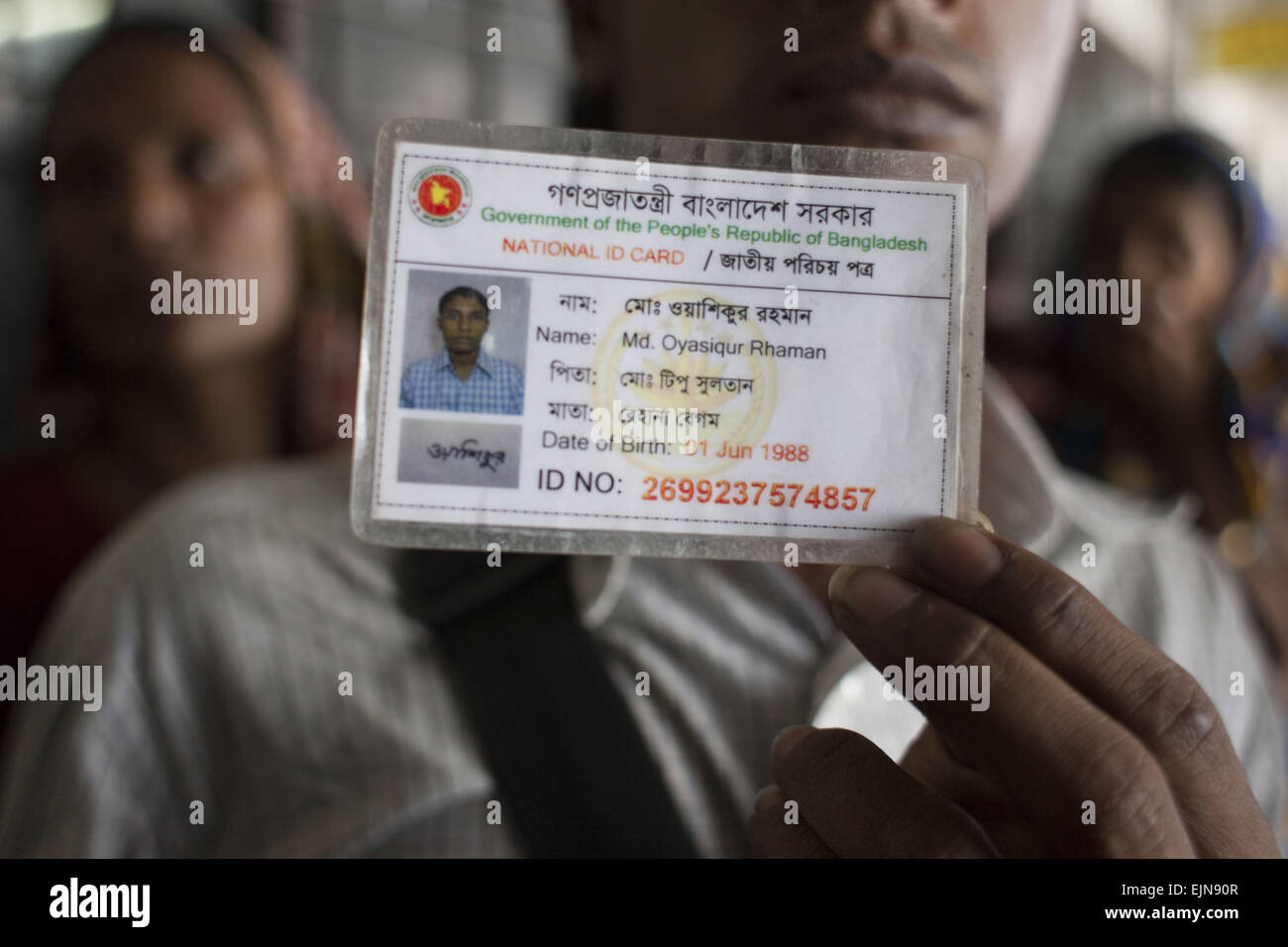 Dhaka, Bangladesh. 30th Mar, 2015. A Bangladeshi man holds the National ID  card of Oyasiqur Rahman Babu, which is recovered from his body. Bangladeshi  blogger Oyasiqur Rahman Babu hacked to death today