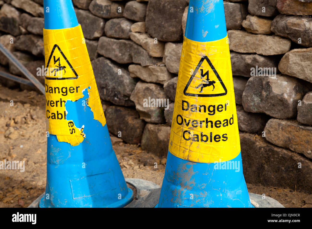 Overhead electricity power lines warning cones in the U.K. Stock Photo