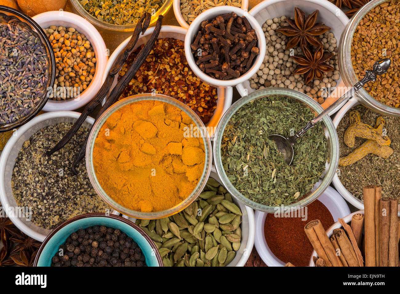 A selection of dried herbs and spices. Use in cooking to add seasoning and flavor to a meal. Stock Photo