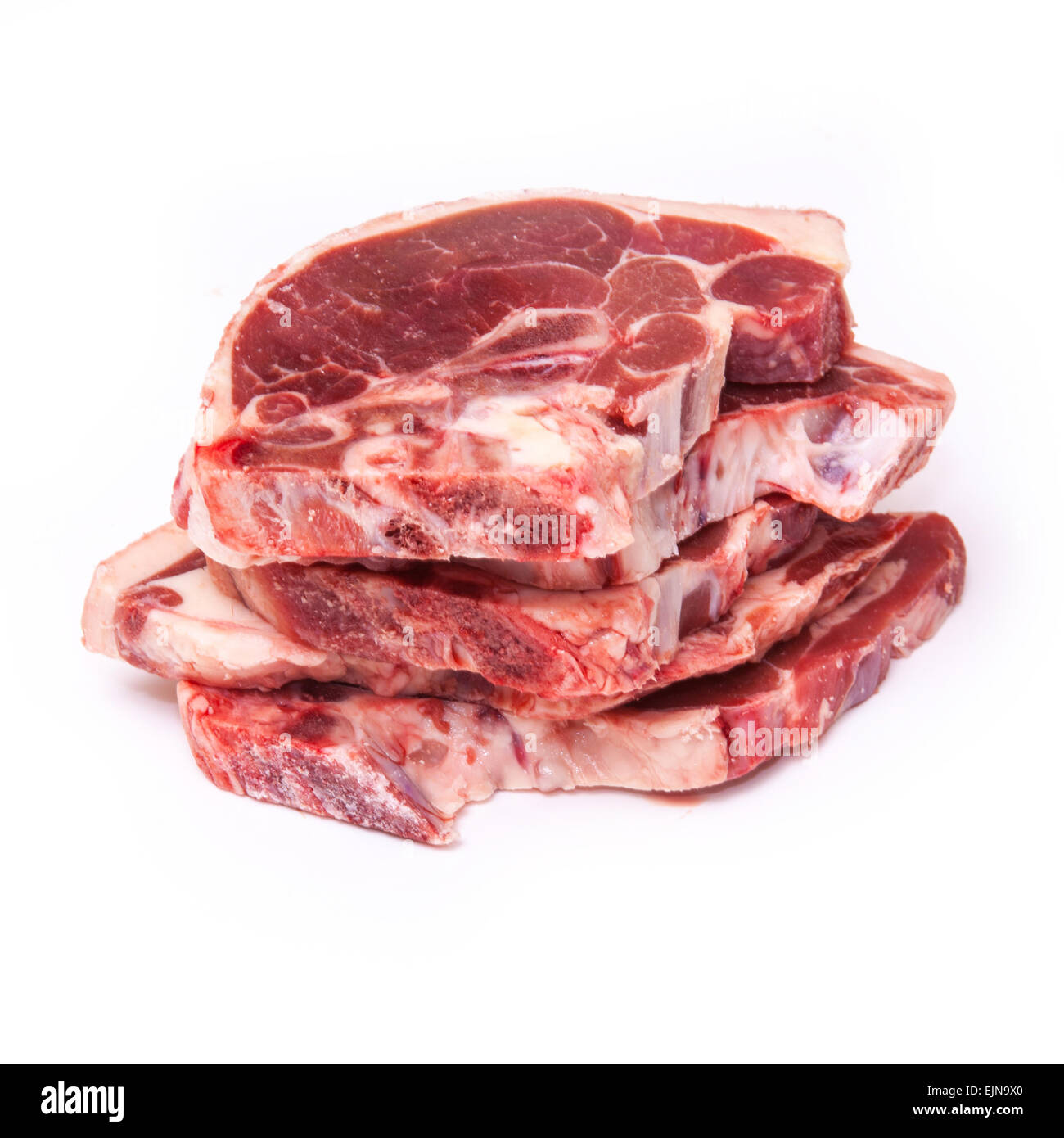 Uncooked New Zealand lamb chops isolated on a white studio background