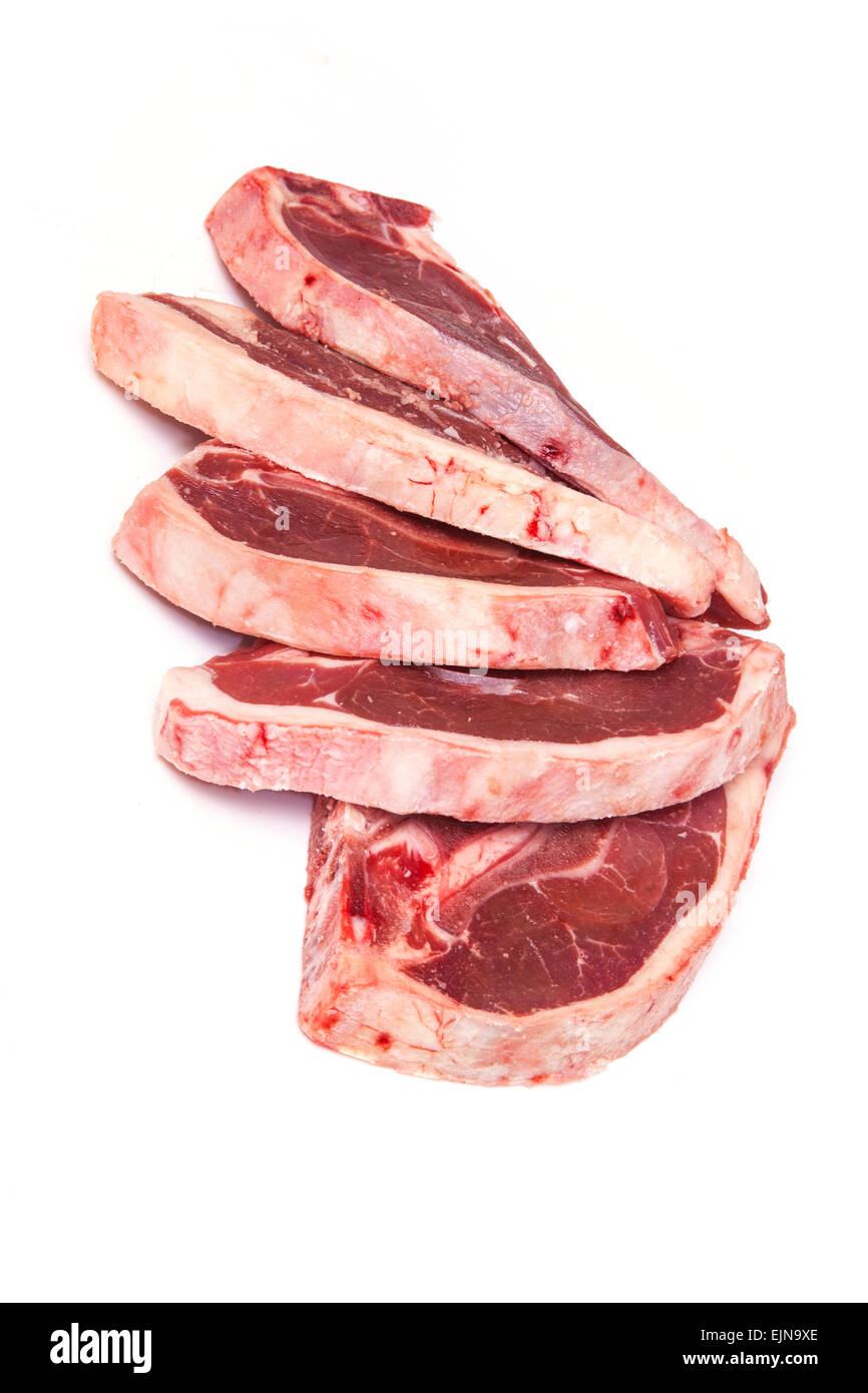 Uncooked New Zealand lamb chops isolated on a white studio background