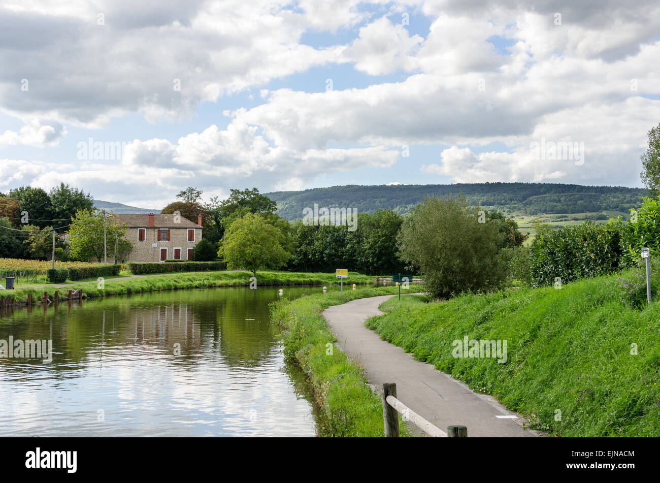 The Canal du Centre curves gracefully through the Burgundian countryside in the village of Remigny, Burgundy, France. Stock Photo