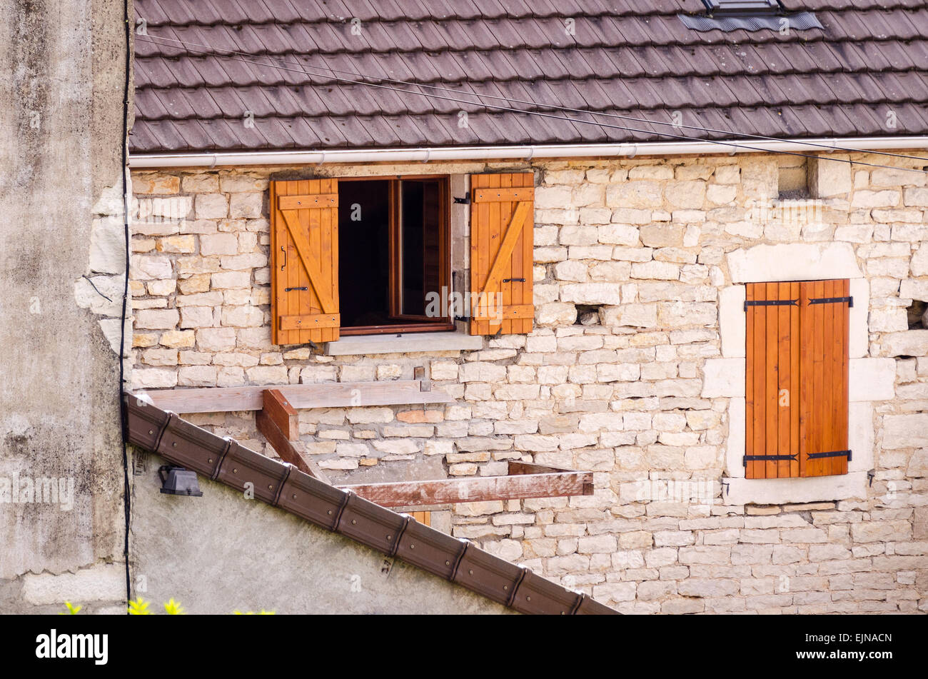 An old stone farm building near Remigny, seen from the Canal du Centre, Burgundy, France. Stock Photo