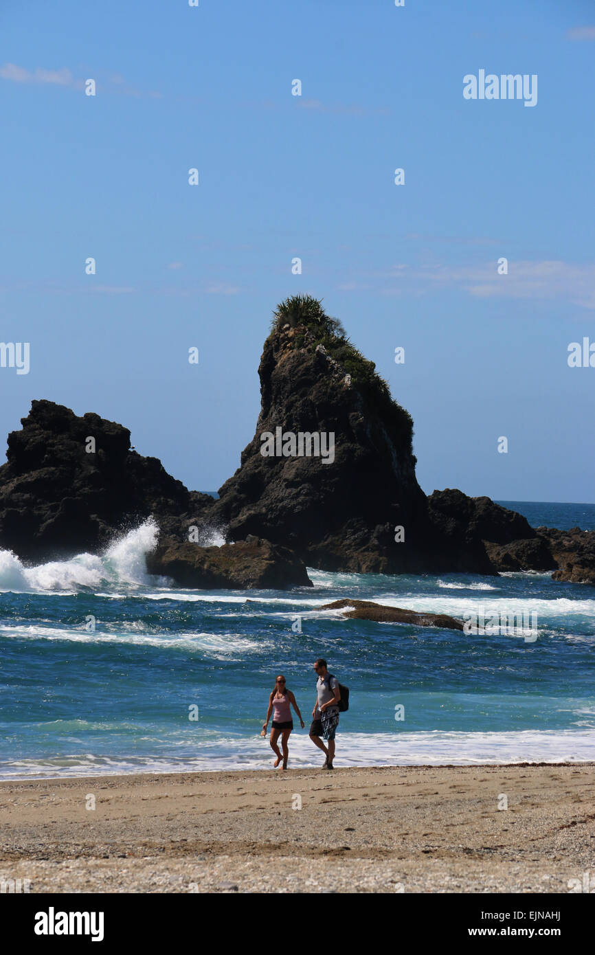 Hikers on Monro beach New Zealand Stock Photo
