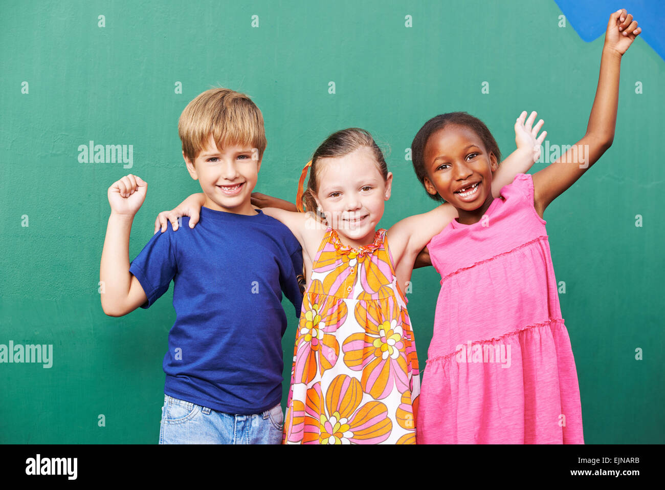 Cheering happy group of children in a kindergarten Stock Photo