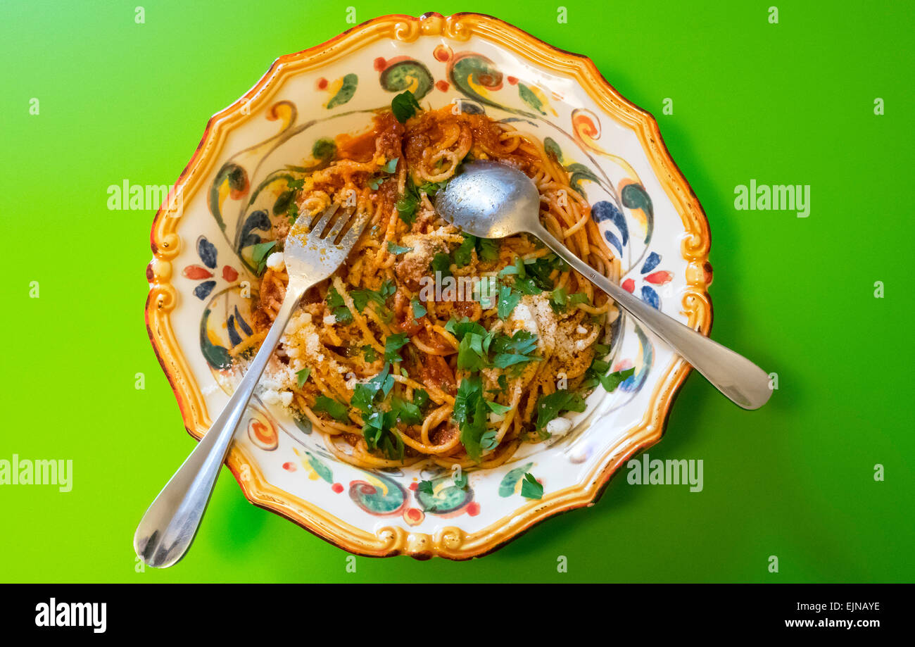 Spaghetti with sardines and olives in ornate Italian bowl, a Sicilian classic recipe Stock Photo