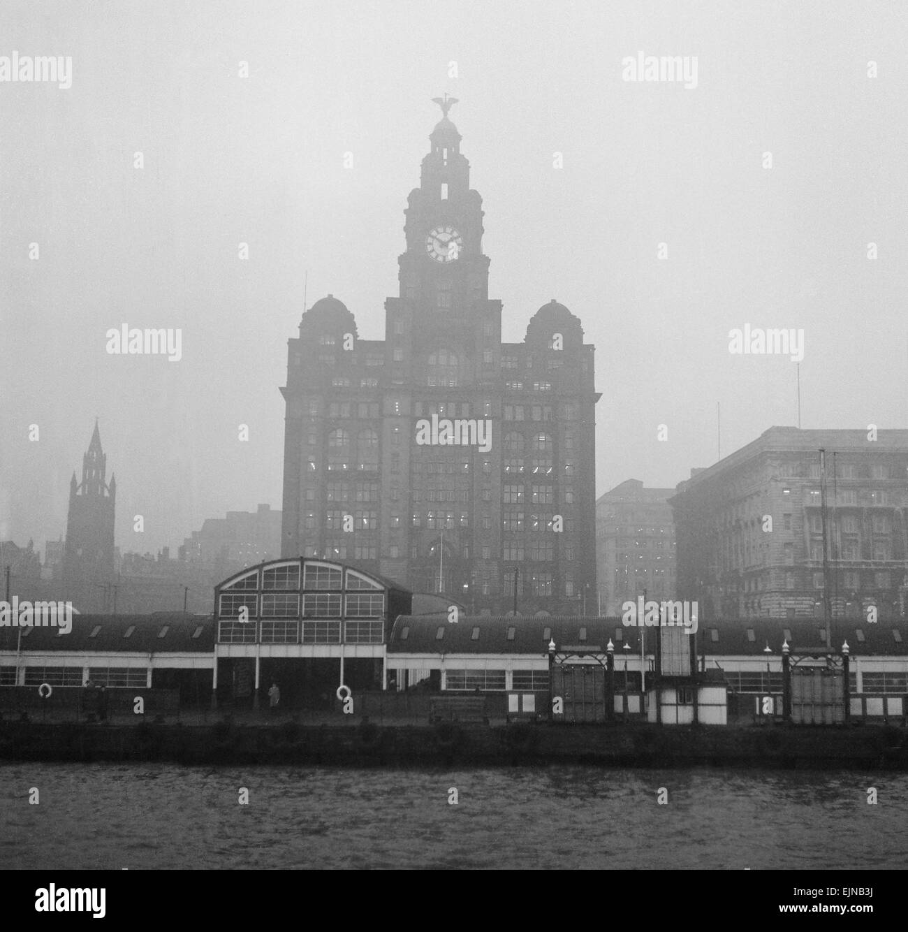 Unemployed and views of Liverpool, 30th November 1962. Docks and Harbour Board offices, the Royal Liver Building and the Cunard building seen from across the Mersey. Stock Photo
