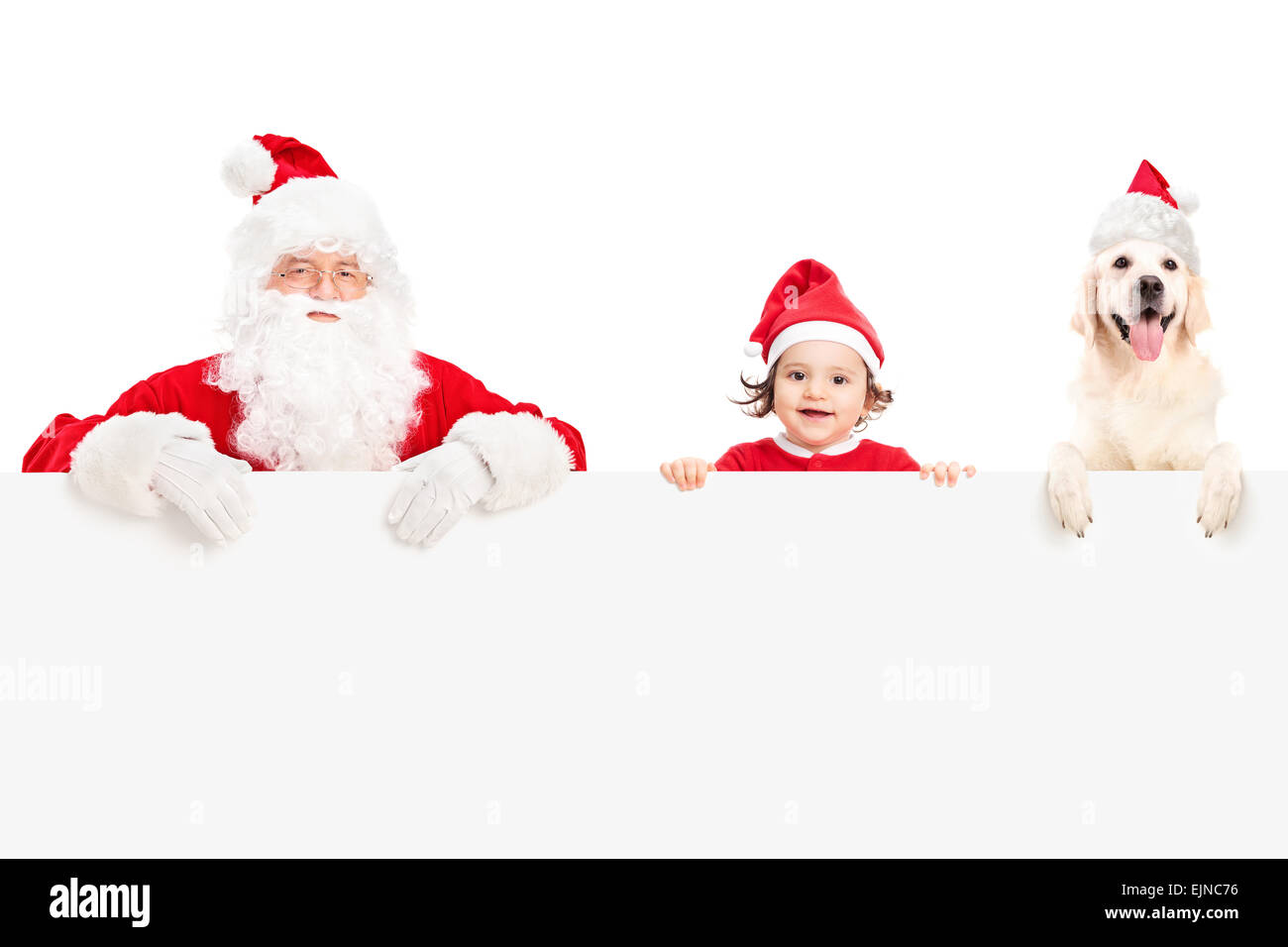 Santa Claus, a cute baby girl and a Labrador retriever dog posing ...