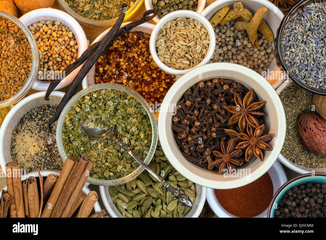 A selection of dried herbs and spices. Use in cooking to add seasoning and flavor to a meal. Stock Photo