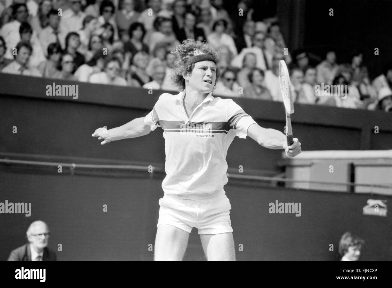 John McEnroe v Tom Gullikson, first round match at Wimbledon on Court Number One, Monday 22nd June 1981. John McEnroe was two flashpoints away from being thrown out of Wimbledon. The number two seed, received one public waring and was then docked 2 penalty points as he beat Tom Gullikson 7-6, 7-5. 6-3 in a bad tempered confrontation on Court One. McEnroe's warning came after he angrily smashed a racket, stamping on the strings and yanking off the handle. Then he was fined the two penalty points for calling umpire Edward James 'the pits of the world', and 'an incompetent fool'. Stock Photo