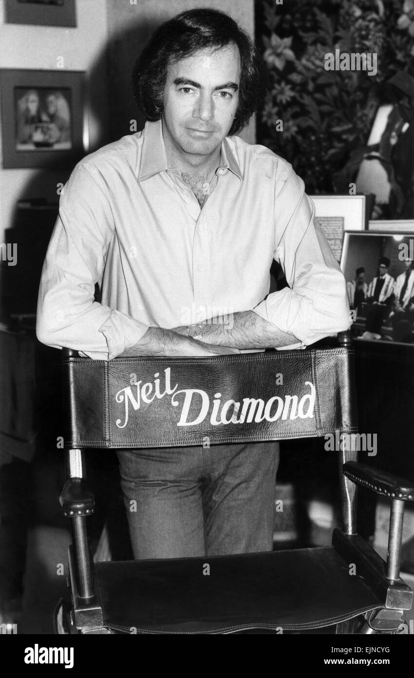 Neil Diamond pictured at his office in Hollywood with his film chair. 5th December 1980. Stock Photo