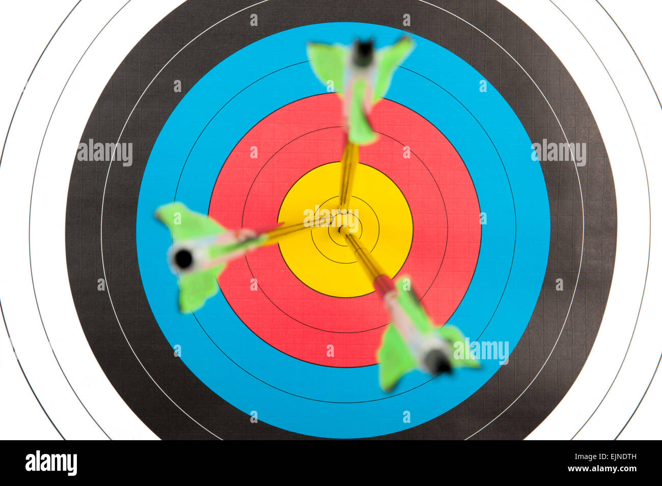 The bull's eye of an archery target with three arrows in short depth of field Stock Photo Alamy