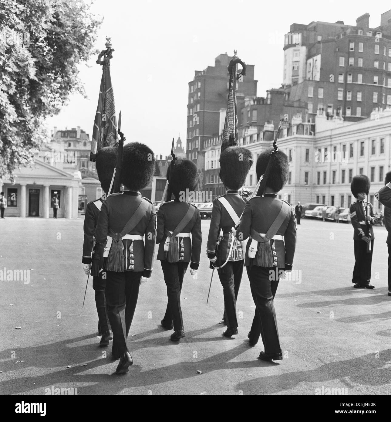 The Coldstream guards seen here parading the regimental colours and battle honours at Chelsea Barrack on the last day they mounted the guard at Buckingham Palace with the old .303 Enfield rifles. Stock Photo