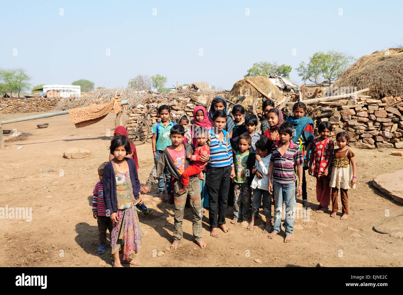 A group of Indian children posing for a the camera Kalpi Village Rajasthan India Stock Photo