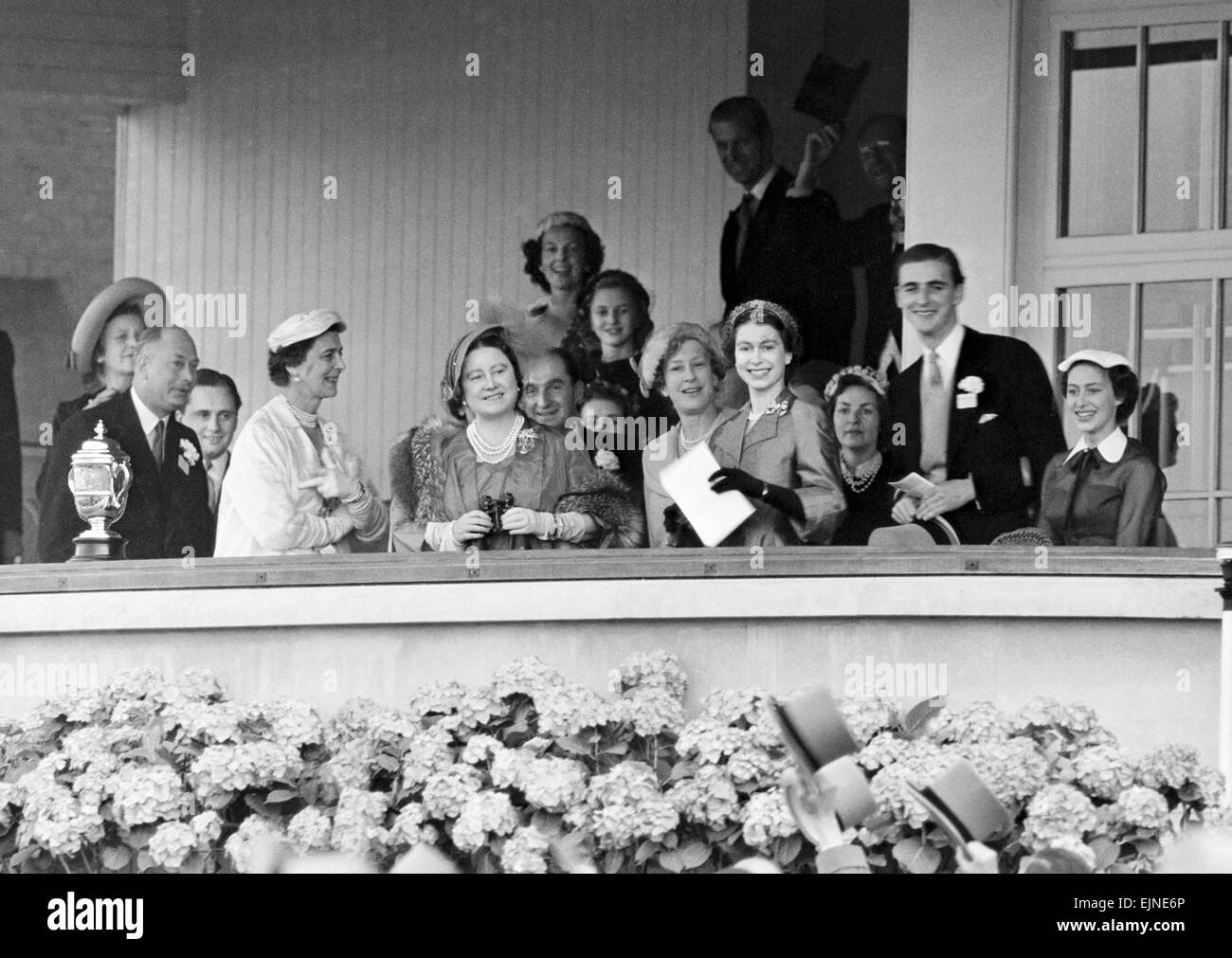 Her Majesty Queen Elizabeth II in happy mood at Ascot after her horse Choir Boy won the Royal Hunt Cup race. Among those who share the Queen's happiness in the Royal Box are the Duchess of Kent, the Queen Mother, the Princess Royal and the Duke of Devonshire. 18th June 1953. Stock Photo