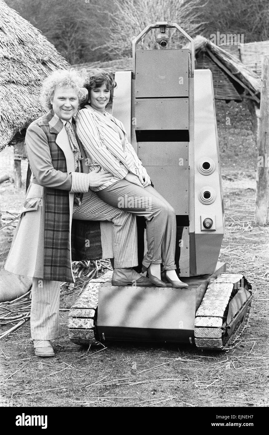 Actor Colin Baker as the sixth Doctor with Nicola Bryant who plays Perpugilliam 'Peri' Brown filming at Butser Ancient Farm Project, Butser Hill, Hampshire for the story The Mysterious Planet 10th April 1986 Stock Photo