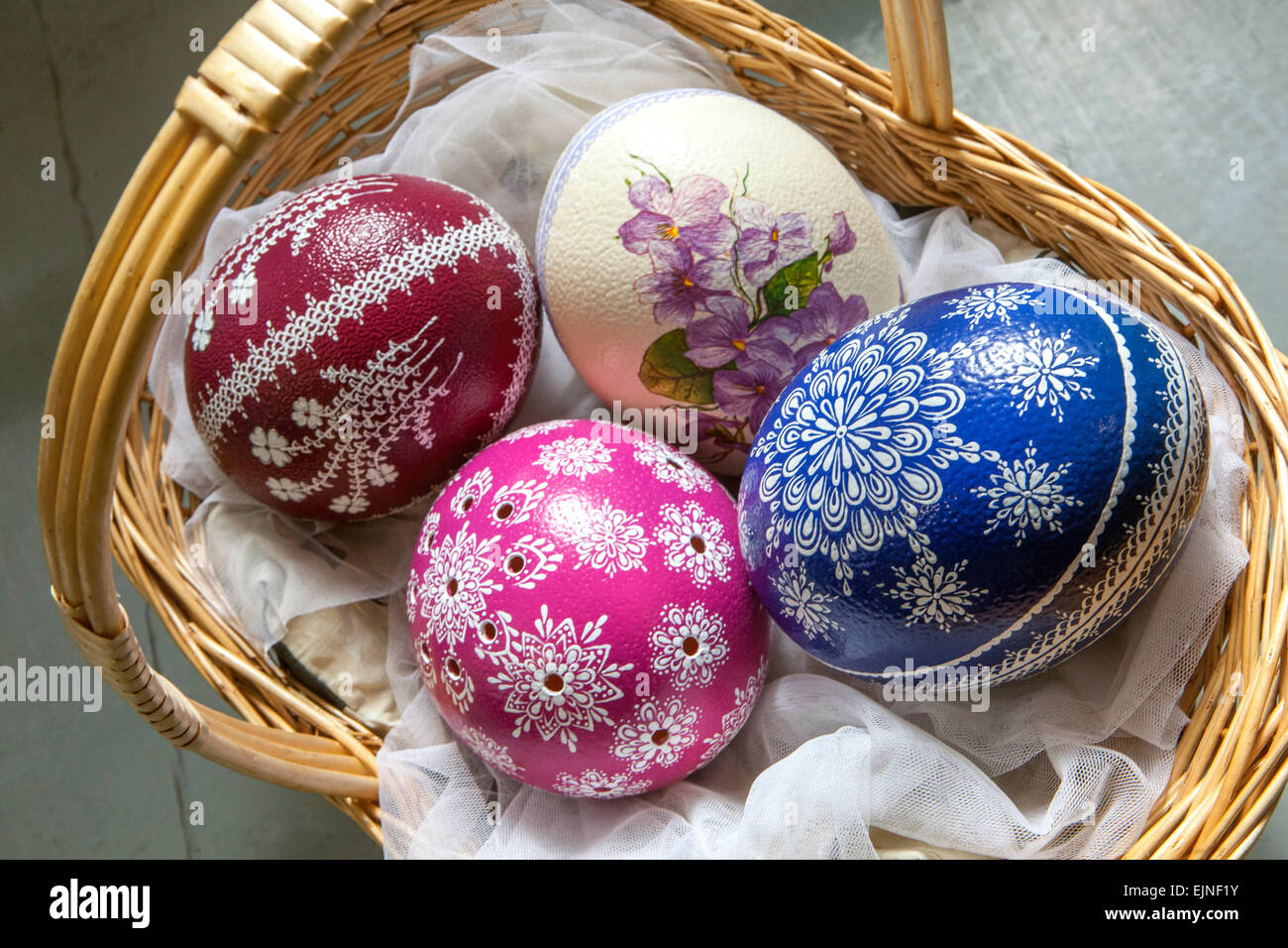 Easter eggs basket Ostrich eggs in a basket Traditional Easter Eggs Prague Czech Republic Europe Easter eggs painted Coloring Easter eggs Fragile Hand Stock Photo