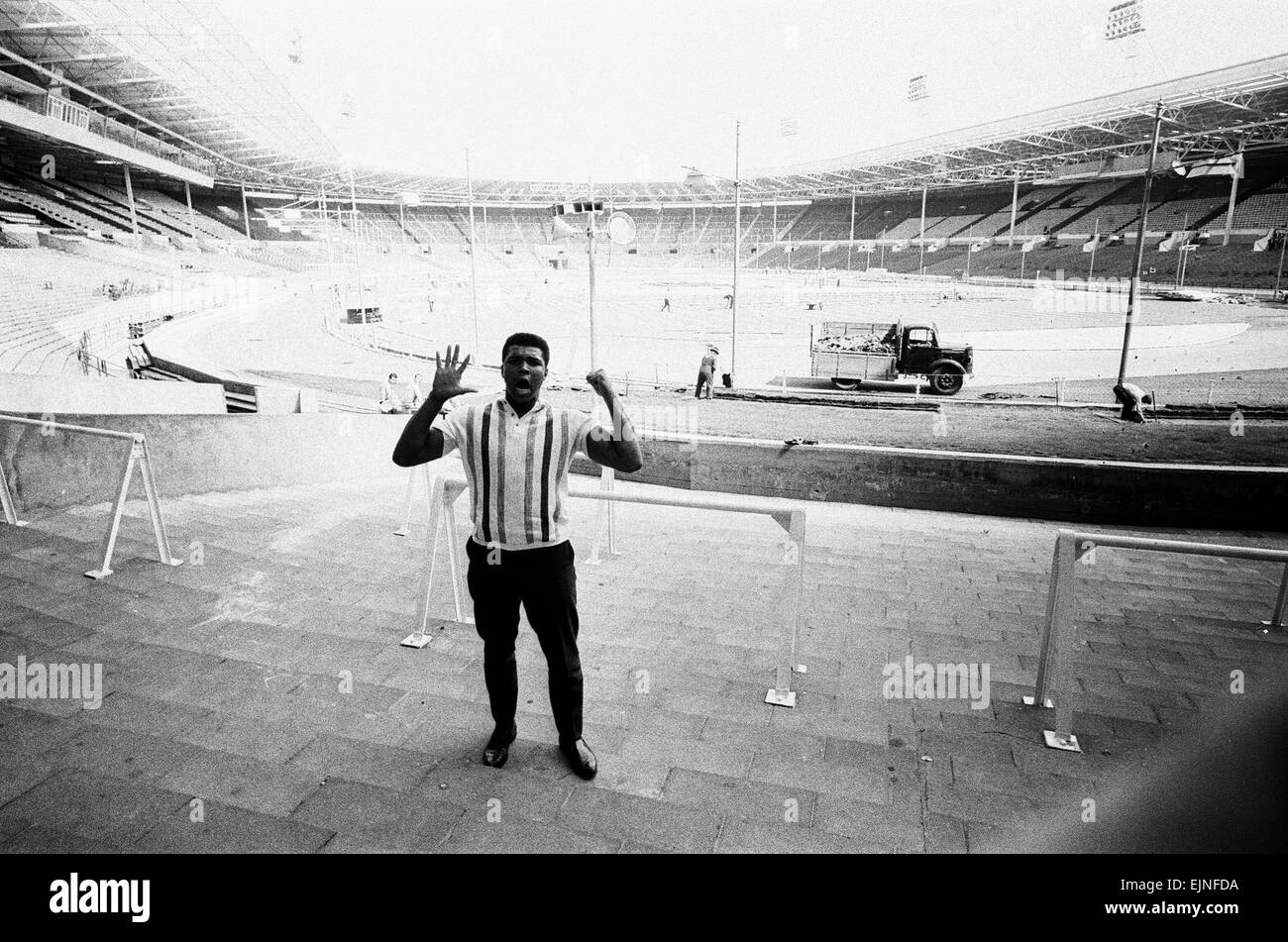 Muhammad Ali seen here at Wembley looking at the preparations for his defence of his world heavyweight title against Brian London and making a prediction that he will put down his oppoent in the 5th round . 12th June 1966 Stock Photo