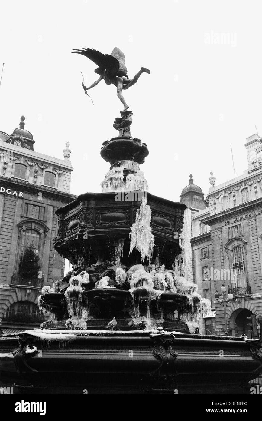 The statue of Eros in Piccadilly Circus covered in ice after a chilly Christmas. 28th December 1970. Stock Photo