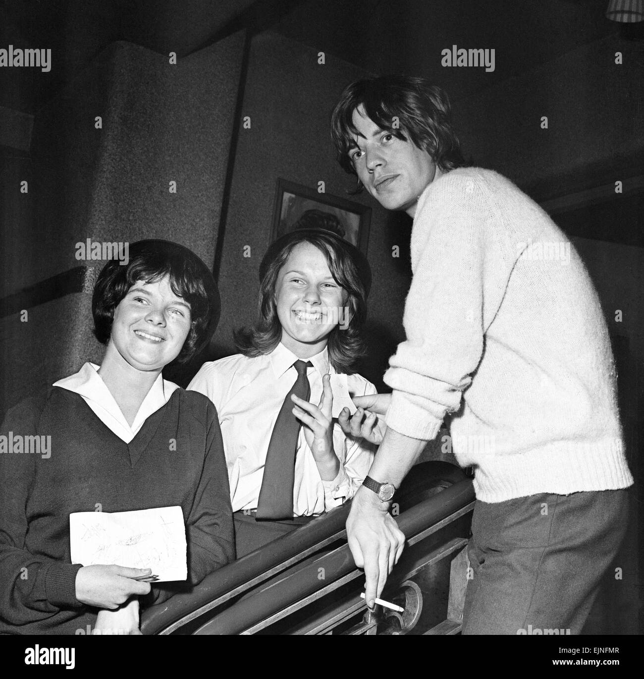 The Rolling Stones: two fans meet Mick Jagger at the ABC Cinema Chester while on tour with Inez & Charlie Foxx.. 14th September 1964. Stock Photo