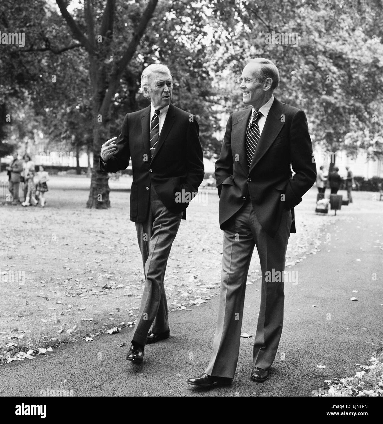 Hollywood stars Henry Fonda and James Stewart walk through Grosvenor Square in London. They are both in London for different stage productions; Henry Fonda is in Clarence Darrow and James Stewart is in the comedy classic Harvey. 11th August 1975. Stock Photo