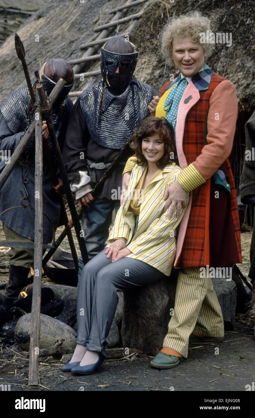 Actor Colin Baker, who plays Doctor Who in the BBC science fiction programme, photographed with his assistant Nicola Bryant who plays Perpugilliam 'Peri' Brown during filming at Butser Ancient Farm Project, Butser Hill, Hampshire for the story The Mysterious Planet, part of the larger Trial of A Time Lord narrative. 10th April 1986. Stock Photo