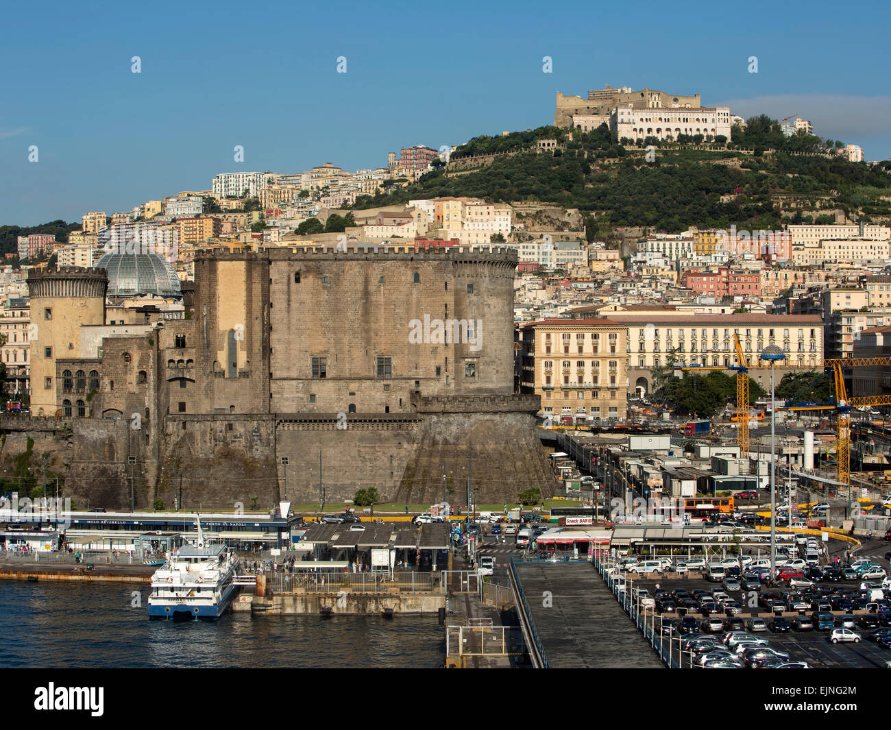 Naples, Italy city hill fort from harbor port Stock Photo