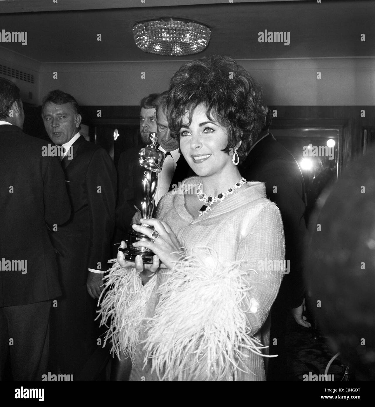 Richard Burton and Elizabeth Taylor seen here at film awards where Mrs.  Taylor received her oscar from Lord Mountbatten. Liz Taylor with the Oscar  which was sent from Hollywood for her to