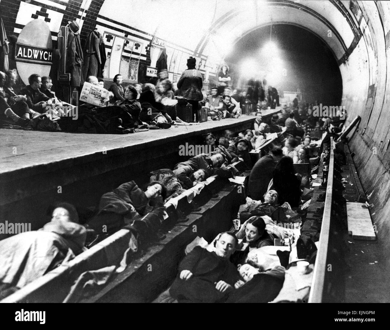 Londoners use Aldwych Underground Station as an air raid shelter during bomb attacks on London during WW2 Circa 1941. Stock Photo