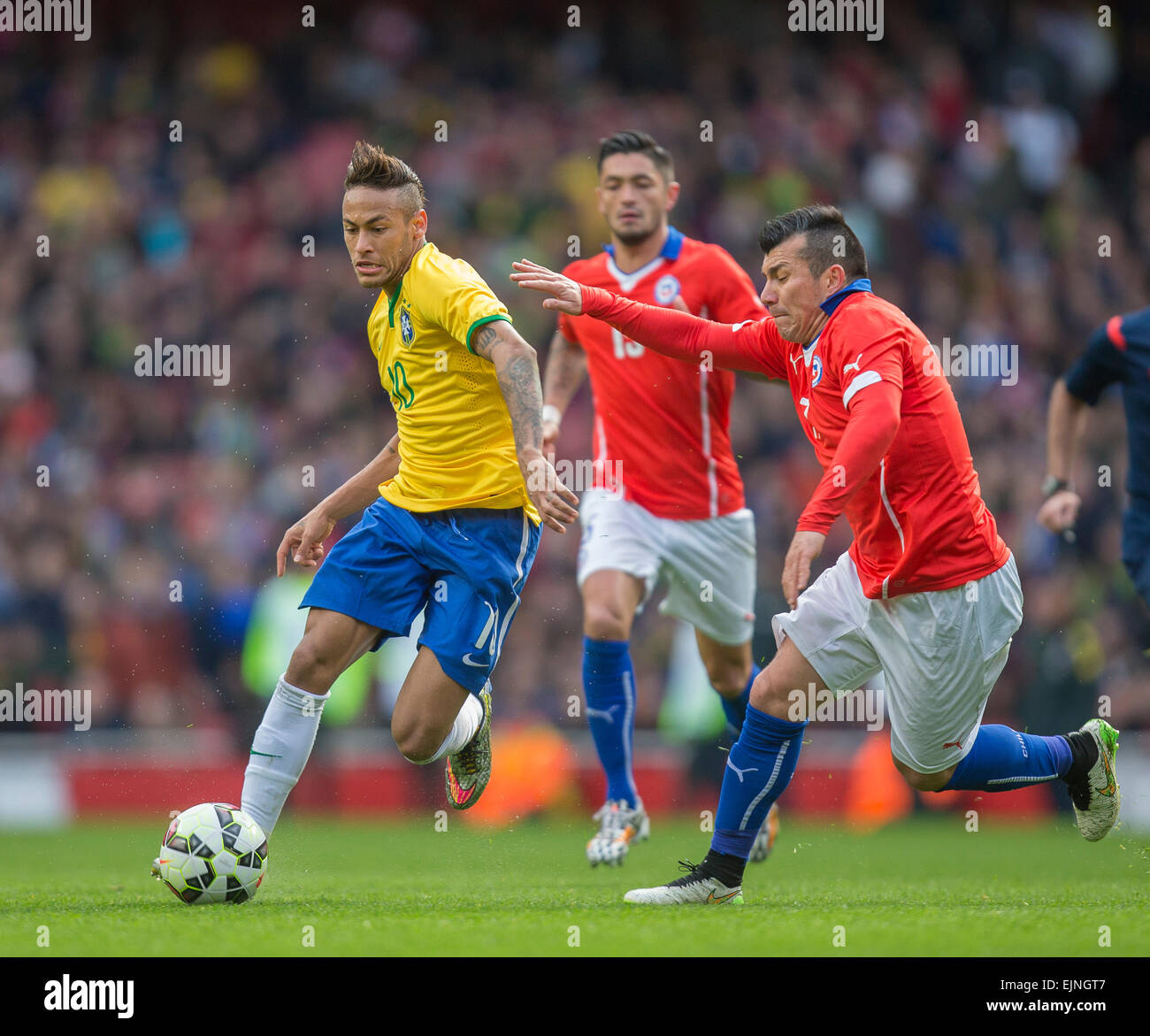London, UK. 29th Mar, 2015. International Football Friendly. Brazil versus Chile. Brazil's Neymar looks to get away from Chile's Gary Medel. Credit:  Action Plus Sports/Alamy Live News Stock Photo