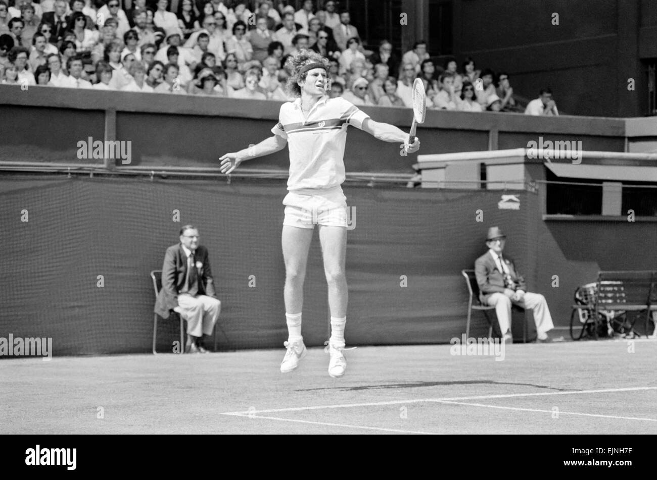 John McEnroe v Tom Gullikson, first round match at Wimbledon on Court Number One, Monday 22nd June 1981. John McEnroe was two flashpoints away from being thrown out of Wimbledon. The number two seed, received one public waring and was then docked 2 penalty points as he beat Tom Gullikson 7-6, 7-5. 6-3 in a bad tempered confrontation on Court One. McEnroe's warning came after he angrily smashed a racket, stamping on the strings and yanking off the handle. Then he was fined the two penalty points for calling umpire Edward James 'the pits of the world', and 'an incompetent fool'. Stock Photo