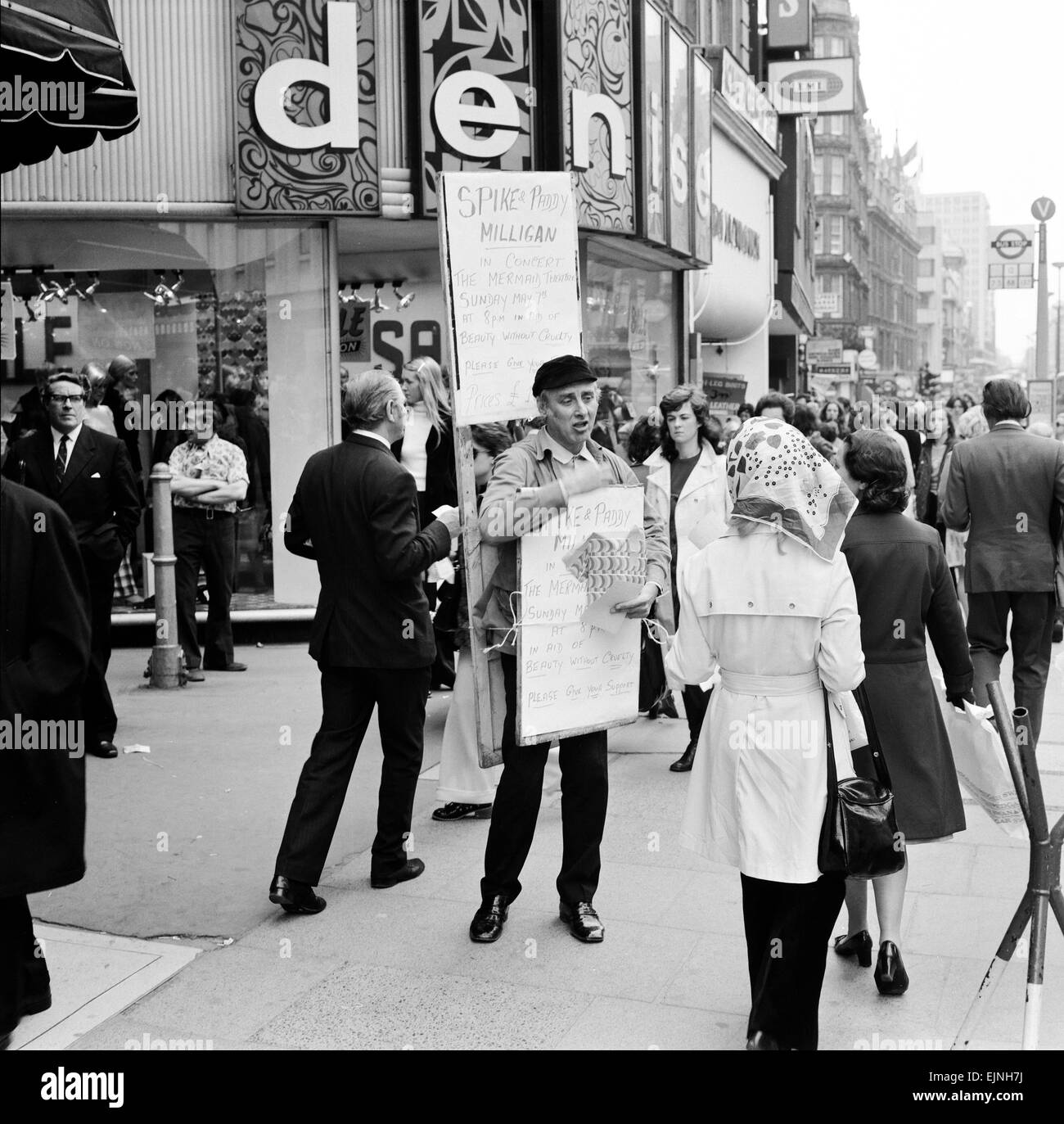 Spike Milligan & wife Paddy use a Sandwich board - borrowed from British Rail Lost Property - to advertise their upcoming charity performance in aid of 'Beauty Without Cruelty' at the Mermaid Theatre London, 4th May 1972. *** Local Caption *** Paddy McMilligan Stock Photo