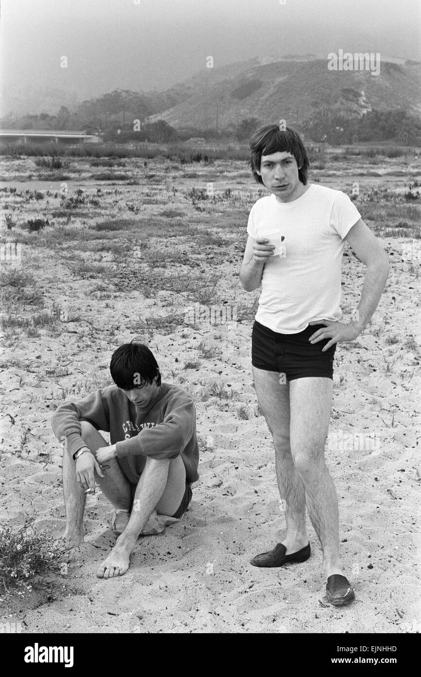The Rolling Stones. Keith Richards and Charlie Watts seen here posing on Malibu beach. According to the photographers ' The boys had some hamburgers and played football and were happy to be beside the sea' However it was too cold to go swimming. During the band's first US tour, 4th June 1964 Stock Photo