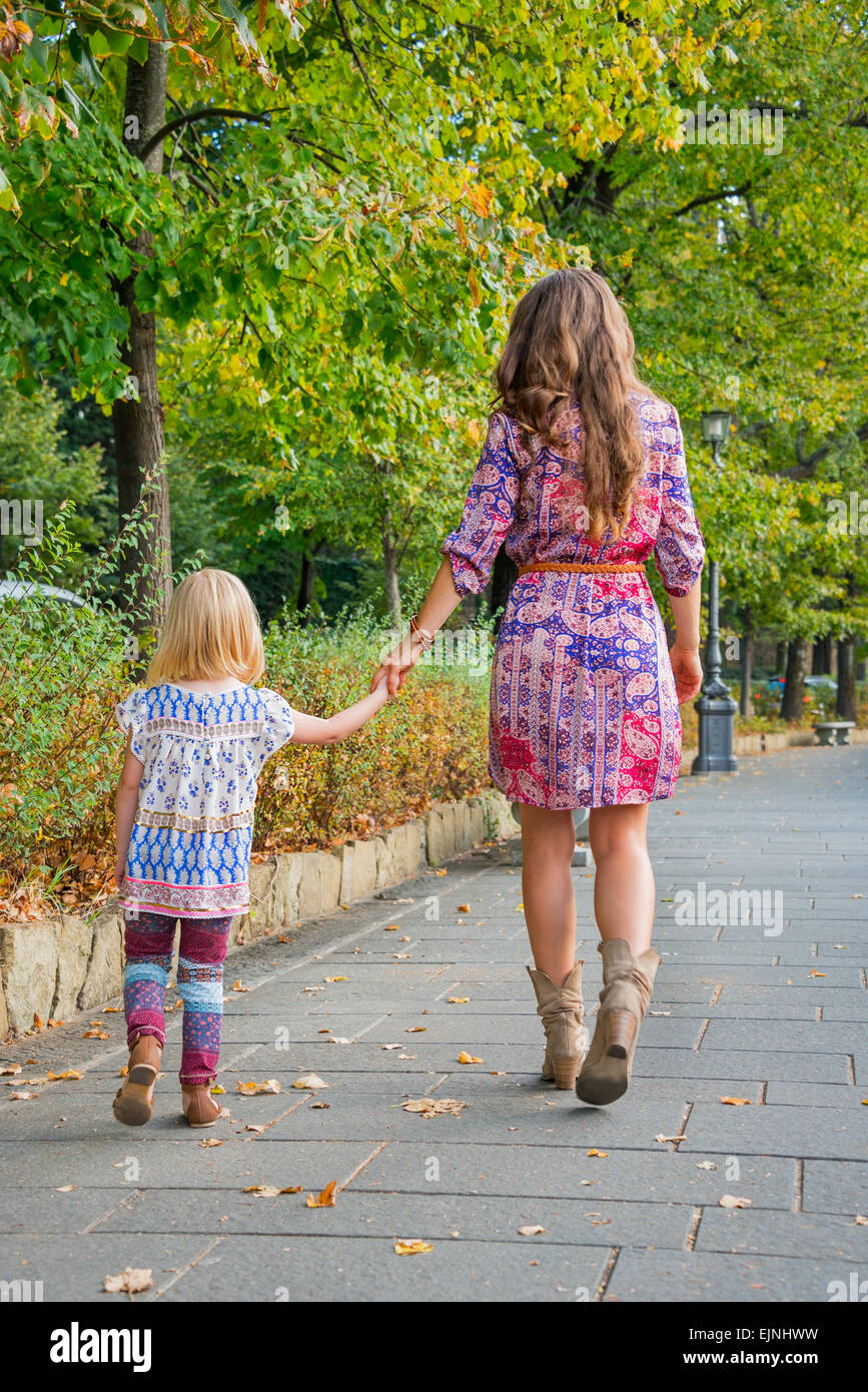 Mother And Daughter Walking In The Park Stock Photo - Download Image Now -  Walking, Rear View, Mother - iStock