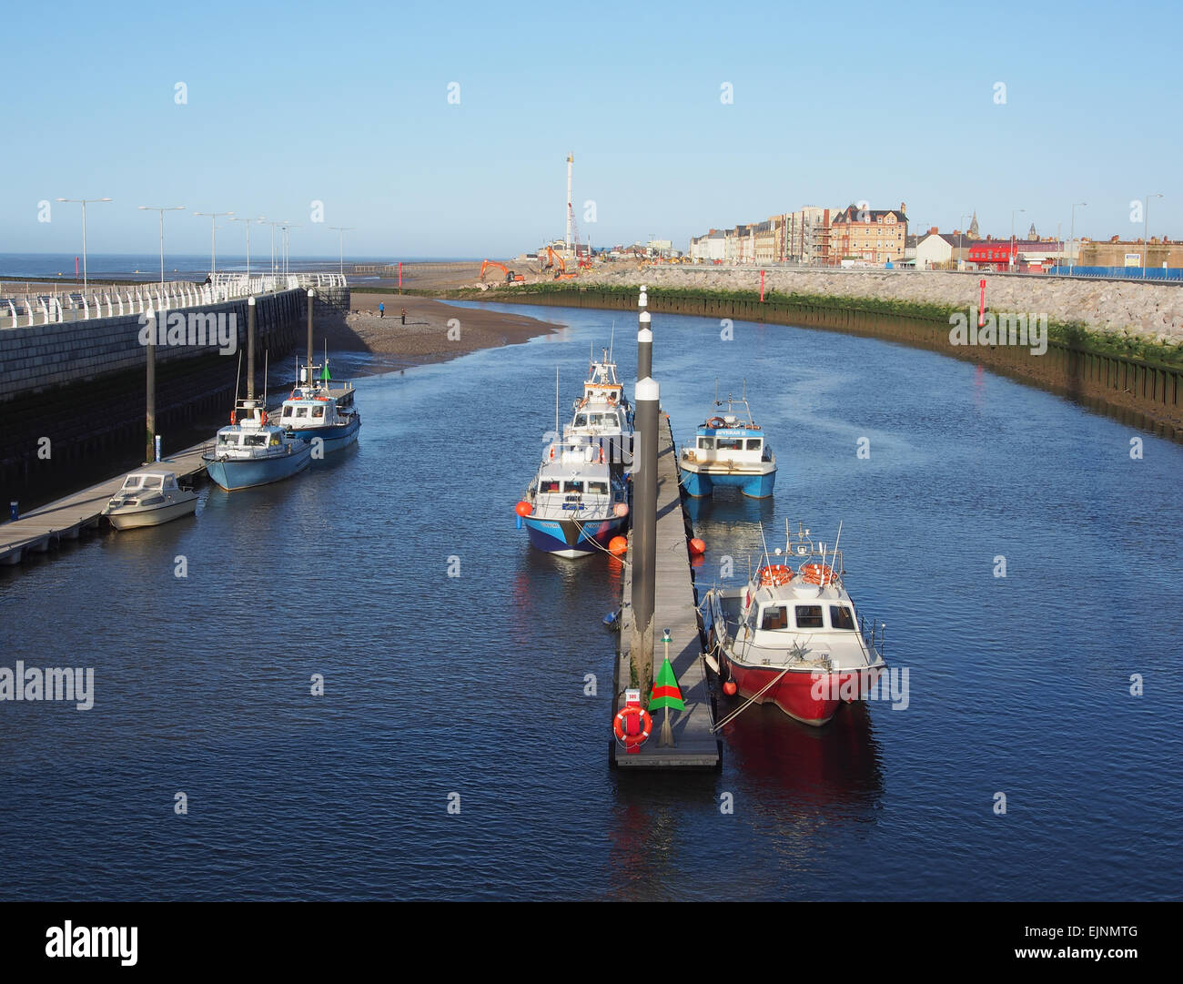 Boats moored at the marina in Kimnel Bay, Rhyl in Wales taken from the Dragon Bridge. Stock Photo