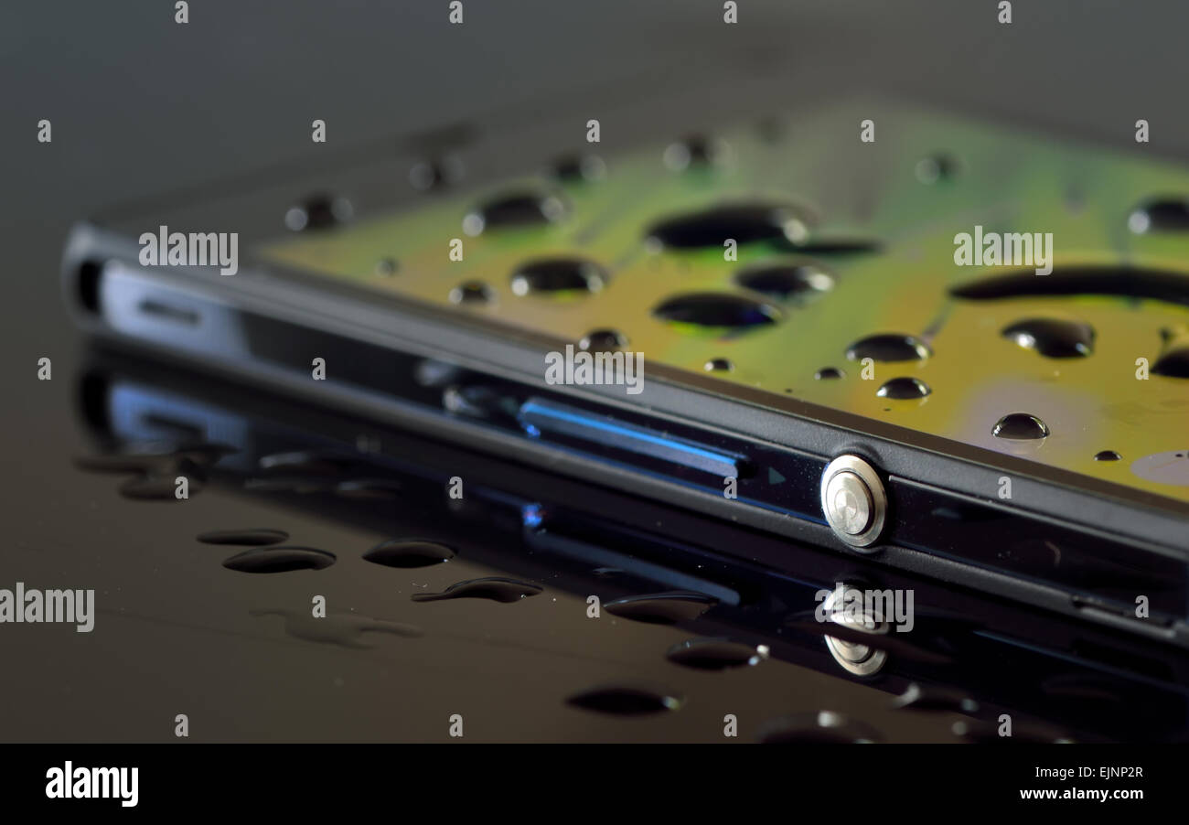 waterproof smartphone with drops and reflexion Stock Photo