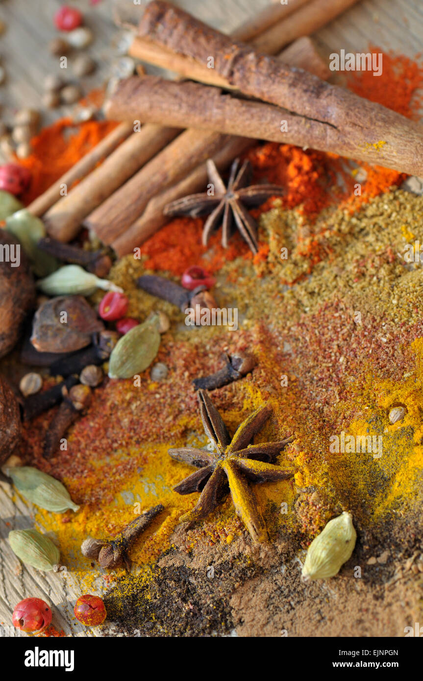 mix of colorful spices on wooden background Stock Photo