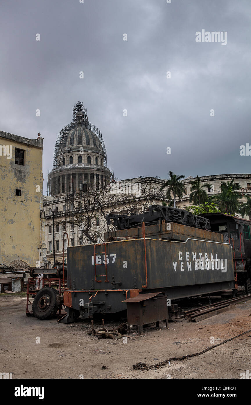 Old American steam train being repaired at a railway yard near the Capitolio building in Old Havana in Cuba Stock Photo