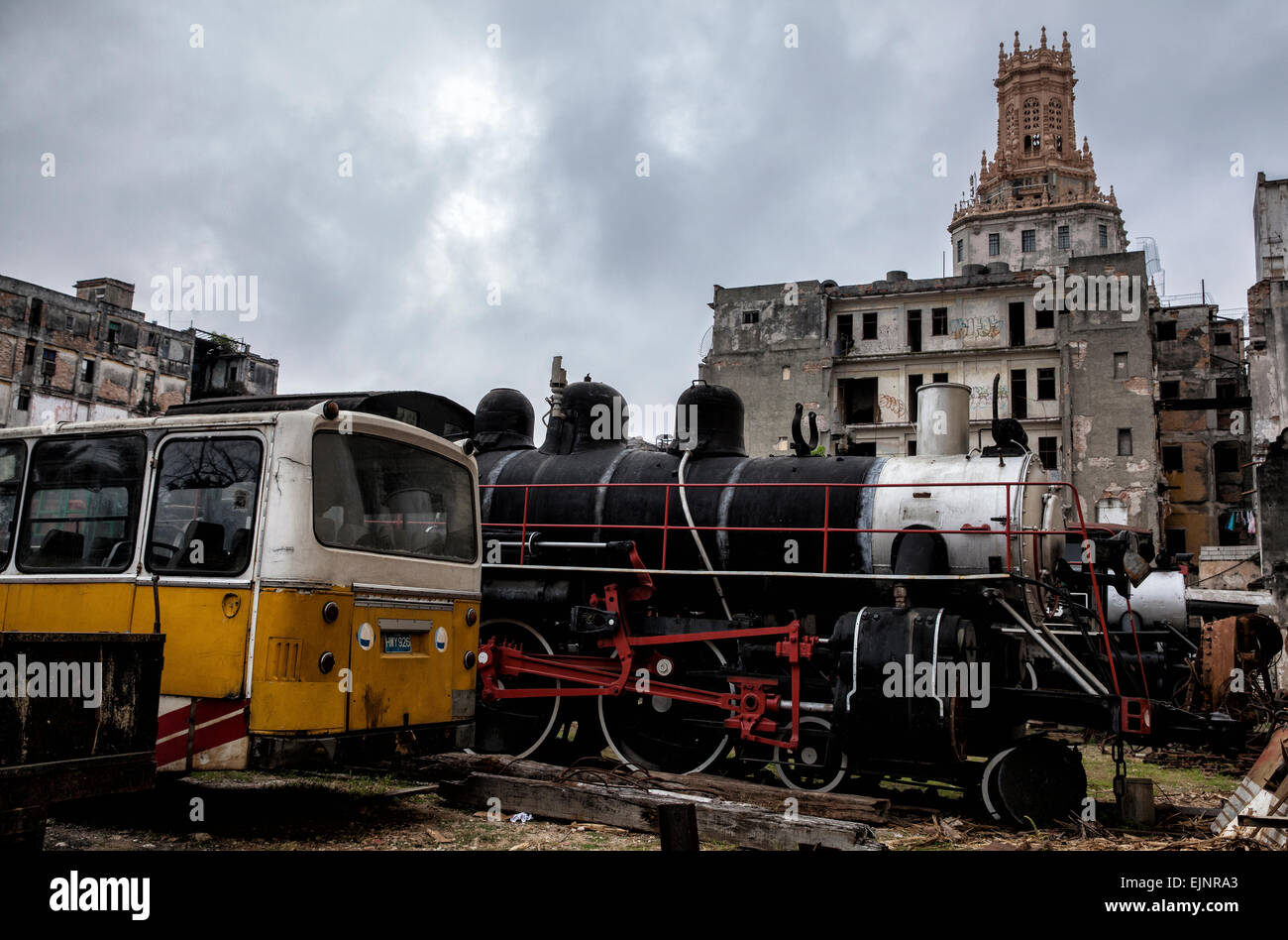 Old steam trains and school buses at a railway yard in central Havana being lovingly restored and repaired to former glory. Stock Photo