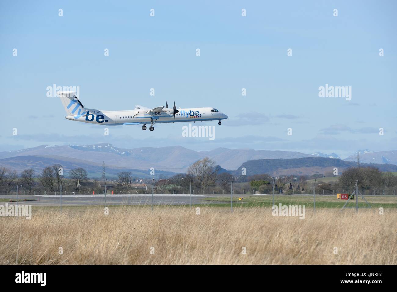 Flybe De Havilland Canada DHC-8 Dash 8 landing at Glasgow international airport, Scotland, Uk Stock Photo