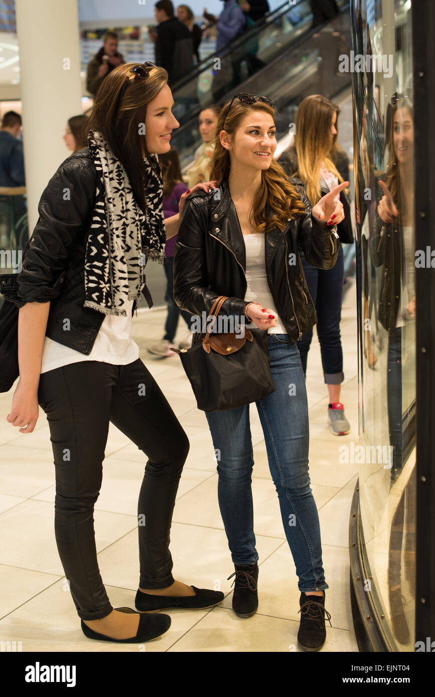 Stuttgart, Germany - March 21, 2015: Two attractive young women are looking  through a shop window in a mall while window shoppin Stock Photo - Alamy