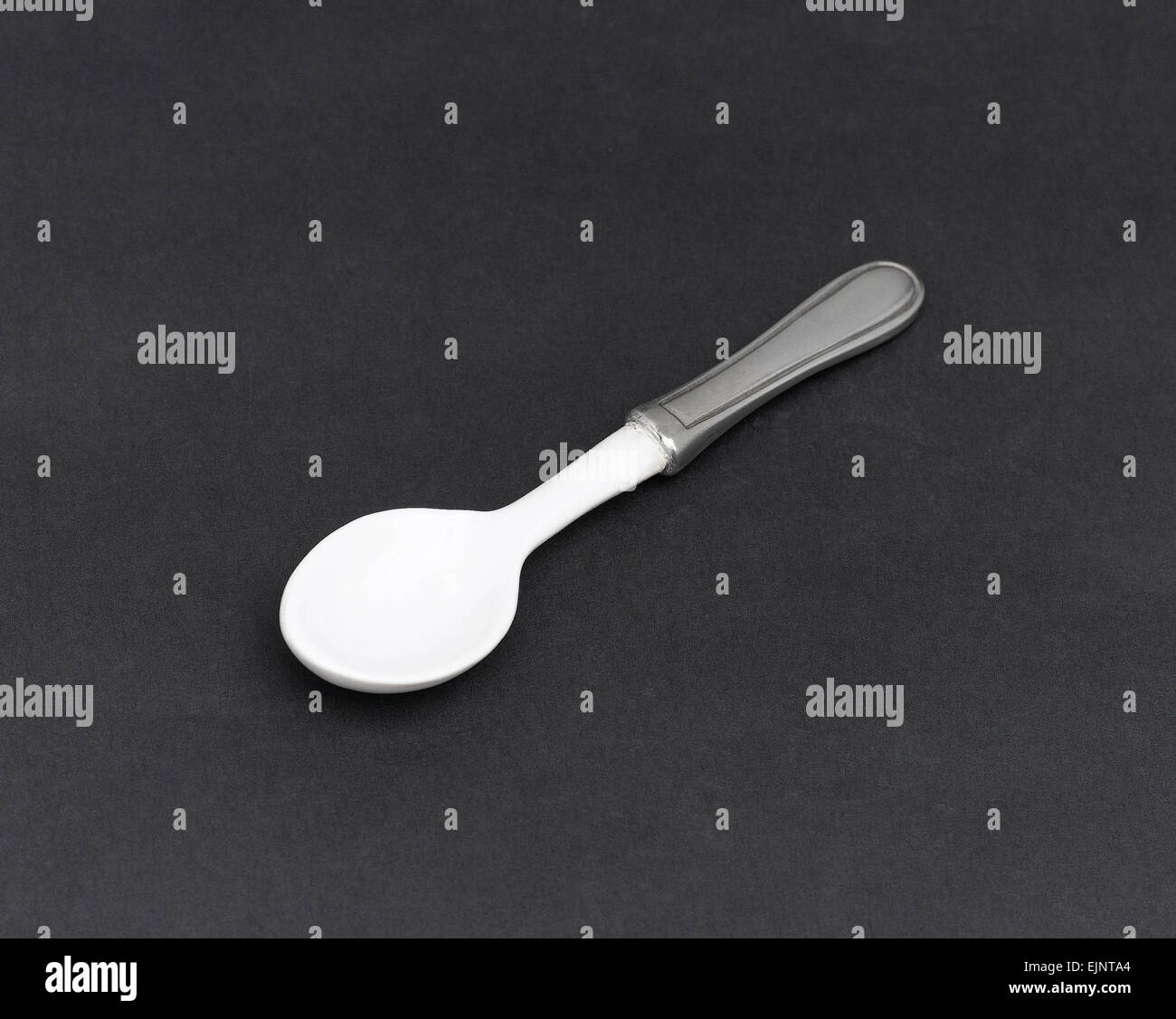 A small spoon for baby , the handle decorated by pewter Stock Photo