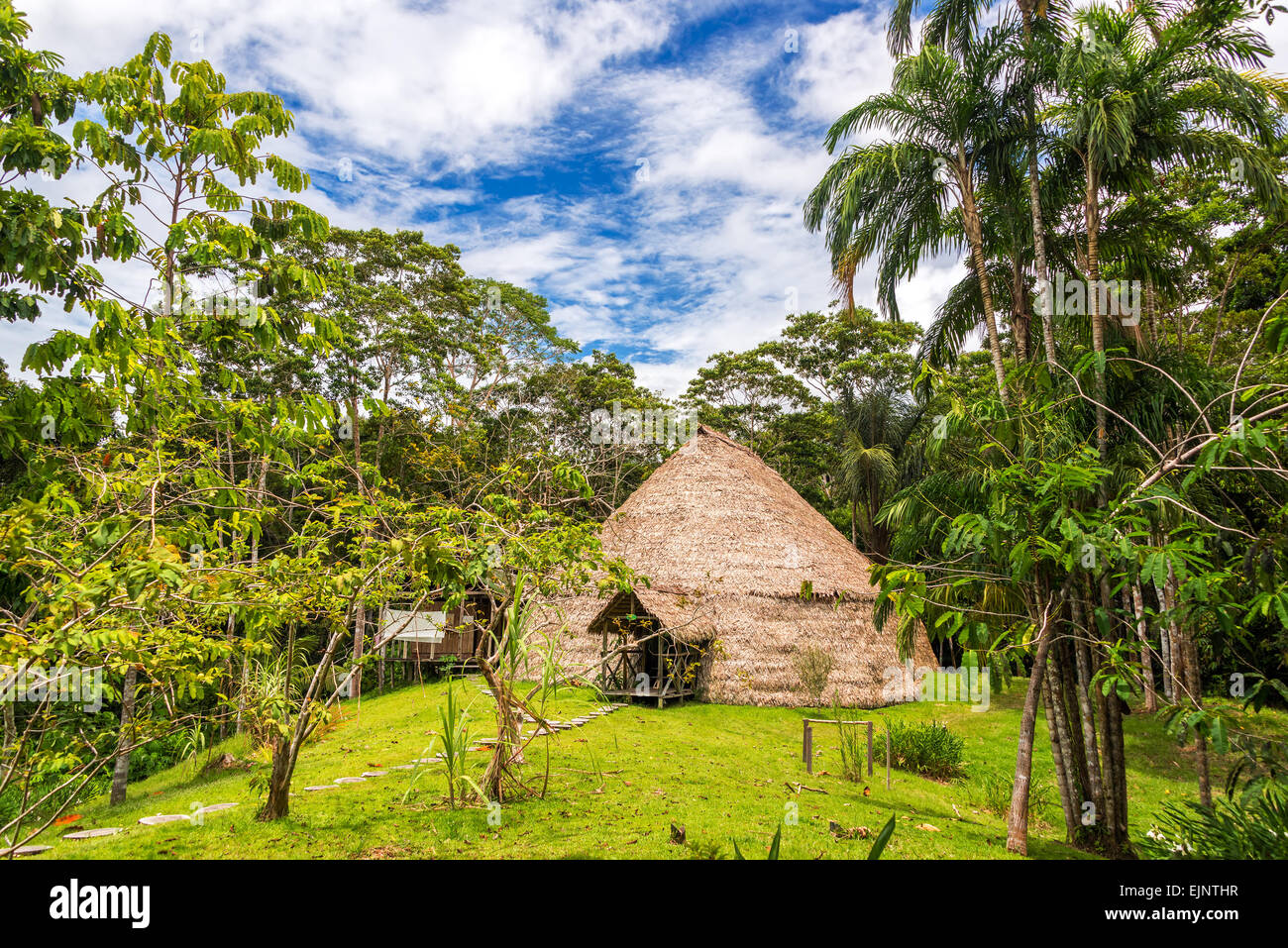 Traditional indigenous dwelling known as a Maloka in the Amazon Rainforest in Brazil Stock Photo