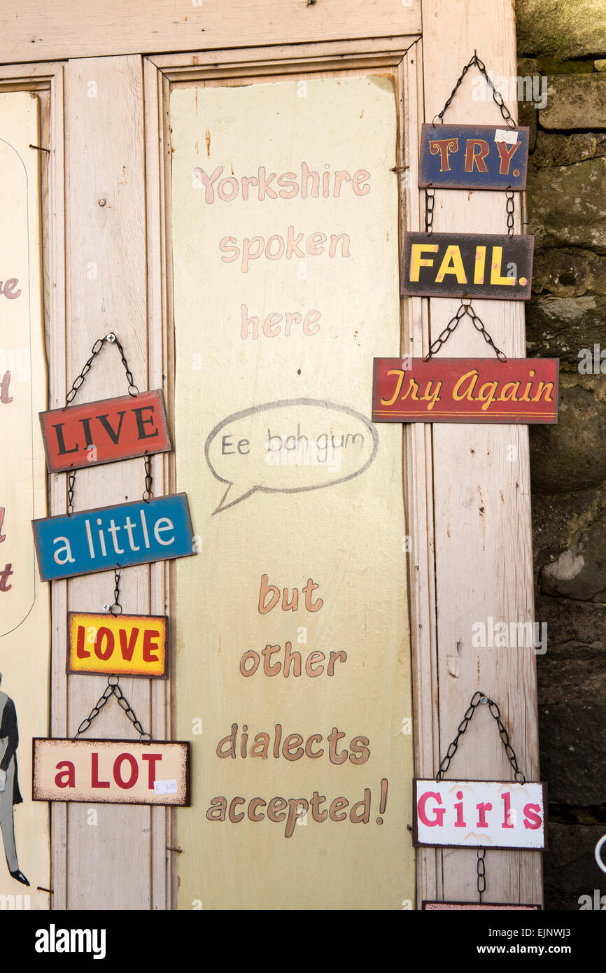 UK, England, Yorkshire, Grassington, Dickensian Festival, amusing Yorkshire spoken here sign on painted wooden door Stock Photo