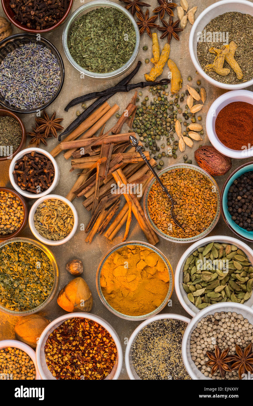 A selection of dried herbs and spices. Use in cooking to add seasoning and flavor to a meal. Stock Photo