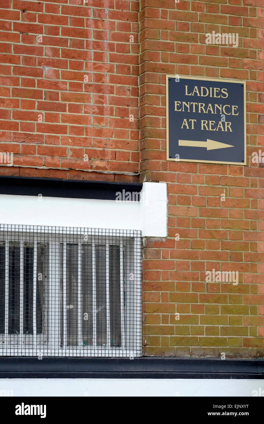 a sign showing the way to ladies separate entrance into the jami mosque